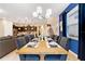 Elegant dining room with wood table and chandelier at 8851 Geneve Ct, Kissimmee, FL 34747