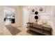 Inviting entryway with a stylish console table and view to the living area at 8851 Geneve Ct, Kissimmee, FL 34747