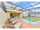 Enjoy this screened-in pool and patio area with plenty of room for relaxation at 8851 Geneve Ct, Kissimmee, FL 34747