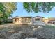 Backyard with gravel ground cover and wooden fence at 1307 Pine Lake Rd, Orlando, FL 32808