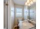 Small bathroom with granite vanity and toilet at 1307 Pine Lake Rd, Orlando, FL 32808