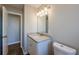 Simple bathroom with granite countertop and white vanity at 1307 Pine Lake Rd, Orlando, FL 32808