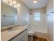 Updated bathroom, granite countertop, bathtub, and window at 1307 Pine Lake Rd, Orlando, FL 32808