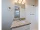 Bathroom with granite vanity, single sink, and shower at 1307 Pine Lake Rd, Orlando, FL 32808