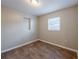 Bright bedroom featuring wood-look floors and a window at 1307 Pine Lake Rd, Orlando, FL 32808