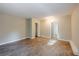 Bright bedroom featuring wood-look floors and a large closet at 1307 Pine Lake Rd, Orlando, FL 32808