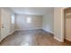 Spacious bedroom with wood-look floors and ample closet space at 1307 Pine Lake Rd, Orlando, FL 32808