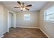 Bedroom with ceiling fan, wood-look floors and closet at 1307 Pine Lake Rd, Orlando, FL 32808