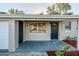 Newly renovated home with a front porch at 1307 Pine Lake Rd, Orlando, FL 32808