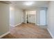 Spacious hallway with wood flooring and storage at 1307 Pine Lake Rd, Orlando, FL 32808
