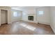 Living room with fireplace and wood-look floors at 1307 Pine Lake Rd, Orlando, FL 32808