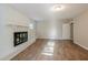 Living room with fireplace and wood-look floors at 1307 Pine Lake Rd, Orlando, FL 32808
