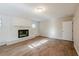 Living room with fireplace and wood-look floors at 1307 Pine Lake Rd, Orlando, FL 32808