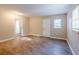 Bright living room with wood-look floors and access to exterior at 1307 Pine Lake Rd, Orlando, FL 32808