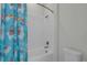 Clean bathroom featuring a tub-shower with white subway tile and a fun llama-themed shower curtain at 15155 Mayberry Dr, Winter Garden, FL 34787