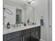 Elegant bathroom vanity with double sinks, modern fixtures, and ample counter space at 15155 Mayberry Dr, Winter Garden, FL 34787