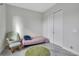 Comfortable bedroom featuring neutral paint, tile floor, closet, and a rocking chair at 15155 Mayberry Dr, Winter Garden, FL 34787