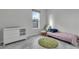 Bedroom featuring neutral paint, tile floor, and a window providing natural light at 15155 Mayberry Dr, Winter Garden, FL 34787