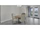 Bright dining area with backyard views, modern lighting, and comfortable seating at 15155 Mayberry Dr, Winter Garden, FL 34787