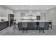 Stylish kitchen with a large center island, modern appliances, and white and gray cabinetry at 15155 Mayberry Dr, Winter Garden, FL 34787