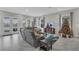 Comfortable living room with modern furnishings, a view of the lake, and a festive Christmas tree at 15155 Mayberry Dr, Winter Garden, FL 34787