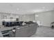 Spacious open-concept living space with modern furnishings, a kitchen island, and a dining area at 15155 Mayberry Dr, Winter Garden, FL 34787