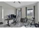 A well-lit office space includes a computer setup, comfortable seating, and natural light at 15155 Mayberry Dr, Winter Garden, FL 34787