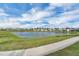 Scenic view of the pond, community, and walking path from the property at 15155 Mayberry Dr, Winter Garden, FL 34787