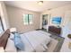 This bedroom features a large window and a spacious closet, as well as staging furniture at 19942 Se 155Th Pl, Umatilla, FL 32784