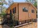 This house features a rustic exterior with wood siding and trim at 19942 Se 155Th Pl, Umatilla, FL 32784