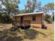 Charming home with wooden deck and a lovely outdoor space at 19942 Se 155Th Pl, Umatilla, FL 32784