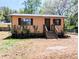 Charming single-story home with a quaint front porch and well-maintained yard at 19942 Se 155Th Pl, Umatilla, FL 32784