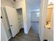 This hallway features light gray wood-style floors and a closet at 19942 Se 155Th Pl, Umatilla, FL 32784