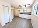 Bright kitchen featuring new cabinets, granite countertops and modern lighting fixtures at 19942 Se 155Th Pl, Umatilla, FL 32784