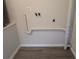 This room features laundry hookups and light gray wood-style floors at 19942 Se 155Th Pl, Umatilla, FL 32784