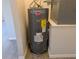 Rheem Performance water heater with Energy Guide rating, installed in an updated utility area on wood-look flooring at 19942 Se 155Th Pl, Umatilla, FL 32784