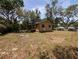 Spacious yard featuring mature trees and lush landscaping at 19942 Se 155Th Pl, Umatilla, FL 32784