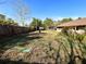 Large backyard with a wooden fence and a pergola at 2708 Sedgefield Avenue, Deltona, FL 32725