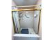 Shower stall with grab bars and tiled walls at 2708 Sedgefield Avenue, Deltona, FL 32725