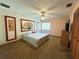 Main bedroom with carpeted floor and ceiling fan at 2708 Sedgefield Avenue, Deltona, FL 32725