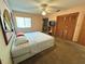Spacious bedroom with large bed and built-in closet at 2708 Sedgefield Avenue, Deltona, FL 32725