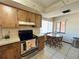 Kitchen boasts wood cabinets, stainless steel appliances, and a breakfast nook at 2708 Sedgefield Avenue, Deltona, FL 32725