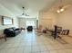 Open living and dining space with tiled floors and ceiling fan at 2708 Sedgefield Avenue, Deltona, FL 32725