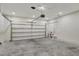 Spacious two car garage with bright lighting and an automatic door at 2829 Shelburne Way, St Cloud, FL 34772