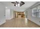 Open living area with tile floors, a ceiling fan, and a combined kitchen space at 2829 Shelburne Way, St Cloud, FL 34772