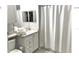 Clean bathroom with shower, toilet and vanity at 8817 Dunes Ct # 203, Kissimmee, FL 34747