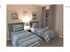 Twin bedroom with two beds and window at 8817 Dunes Ct # 203, Kissimmee, FL 34747