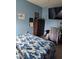 Bright bedroom with a large bed, dresser, and plenty of closet space at 1009 Fort Smith Blvd, Deltona, FL 32725