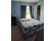 Comfortable bedroom featuring a double bed and window with natural light at 1009 Fort Smith Blvd, Deltona, FL 32725