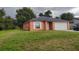 One-story house with a white garage door and green lawn at 1009 Fort Smith Blvd, Deltona, FL 32725